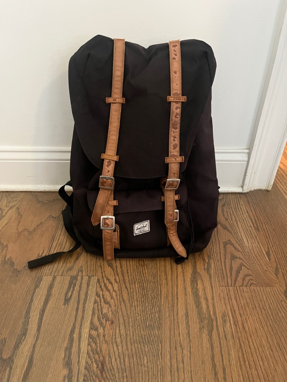 Herschel Supply Company black backpack with tan leather straps